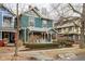 Charming two-story home with blue-green siding and a cozy front porch at 1468 Alabama St, Indianapolis, IN 46202