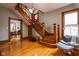 Elegant foyer with refinished hardwood floors, detailed staircase, and a welcoming ambiance at 1468 Alabama St, Indianapolis, IN 46202