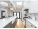 Kitchen featuring stainless steel appliances, gray shaker cabinets, and a center island with a sink at 1468 Alabama St, Indianapolis, IN 46202