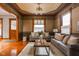Inviting living room showcasing detailed ceilings, patterned wallpaper, and hardwood floors at 1468 Alabama St, Indianapolis, IN 46202