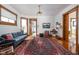 Spacious living room with hardwood floors, a large rug, and classic architectural details at 1468 Alabama St, Indianapolis, IN 46202