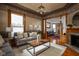 Bright living room featuring decorative ceilings, patterned wallpaper, and hardwood floors at 1468 Alabama St, Indianapolis, IN 46202