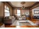 Charming living room boasting decorative ceilings, patterned wallpaper, and hardwood floors at 1468 Alabama St, Indianapolis, IN 46202