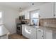 Bright kitchen with stainless steel appliances and white cabinets at 1602 S P St, Elwood, IN 46036