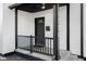 Modern front porch with black railing and stylish entry door at 1730 Union St, Columbus, IN 47201