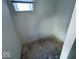 Small bathroom with vinyl flooring, ready for finishing at 2035 Carrollton Ave, Indianapolis, IN 46202