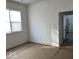 Bright bedroom with large windows and hardwood floors at 2035 Carrollton Ave, Indianapolis, IN 46202