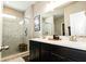 Double vanity bathroom with marble shower and dark wood cabinets at 2394 Eagle Ave, Plainfield, IN 46168