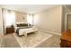 Spacious bedroom with a king-size bed, carpet flooring, and large windows at 2394 Eagle Ave, Plainfield, IN 46168