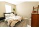 Bedroom with queen bed, neutral decor, and hardwood floors at 2394 Eagle Ave, Plainfield, IN 46168