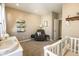 Bedroom with recliner, changing table, and bookshelves at 2394 Eagle Ave, Plainfield, IN 46168