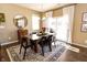 Bright dining room with hardwood floors, a wooden table, and sliding glass doors at 2394 Eagle Ave, Plainfield, IN 46168