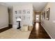Hallway with hardwood floors, and framed photos on the wall at 2394 Eagle Ave, Plainfield, IN 46168