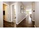 Long hallway with hardwood floors and views into other rooms at 2394 Eagle Ave, Plainfield, IN 46168