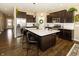 Modern kitchen with dark cabinetry, stainless steel appliances, and an island at 2394 Eagle Ave, Plainfield, IN 46168