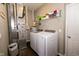 Laundry room with washer, dryer, and storage shelves at 2394 Eagle Ave, Plainfield, IN 46168