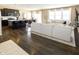 Open floor plan with hardwood floors, large sectional sofa, and kitchen island at 2394 Eagle Ave, Plainfield, IN 46168