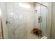 Large walk-in shower with marble tile and built-in shelving at 2394 Eagle Ave, Plainfield, IN 46168