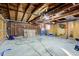 Unfinished garage interior with exposed wooden beams and various tools at 2835 Walker Ave, Indianapolis, IN 46203