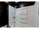 White shower with shelf and black accent wall at 2835 Walker Ave, Indianapolis, IN 46203