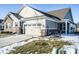 House exterior showcasing a two-car garage and partial brick front at 3256 Jasper Ln, Brownsburg, IN 46112