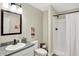 Clean bathroom, featuring a shower, toilet and granite countertop at 3264 Orchard Ave, Indianapolis, IN 46218