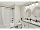 Bathroom with tub, shower, double vanity, and granite countertop at 3264 Orchard Ave, Indianapolis, IN 46218