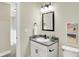Modern bathroom with granite vanity, updated fixtures, and framed art at 3264 Orchard Ave, Indianapolis, IN 46218