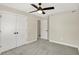 Well-lit bedroom with double doors and access to another room at 3264 Orchard Ave, Indianapolis, IN 46218