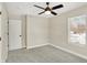 Charming bedroom with ceiling fan and a window offering natural light at 3264 Orchard Ave, Indianapolis, IN 46218