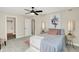 Bedroom with ceiling fan, plush rug, and en-suite bathroom at 3264 Orchard Ave, Indianapolis, IN 46218