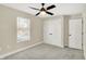 Bedroom with double door closet, ceiling fan and window at 3264 Orchard Ave, Indianapolis, IN 46218