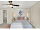 Bright bedroom with carpet flooring, ceiling fan, and window at 3264 Orchard Ave, Indianapolis, IN 46218