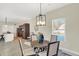 Bright dining area with rustic table and view into kitchen at 3264 Orchard Ave, Indianapolis, IN 46218