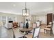 Charming dining area with a rustic table and modern lighting at 3264 Orchard Ave, Indianapolis, IN 46218