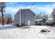 Gray house exterior with snowy yard, showcasing the back of the house at 3264 Orchard Ave, Indianapolis, IN 46218