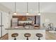 Granite island kitchen with stainless steel appliances and pendant lighting at 3264 Orchard Ave, Indianapolis, IN 46218