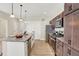 Modern kitchen with stainless steel appliances and dark wood cabinets at 3264 Orchard Ave, Indianapolis, IN 46218
