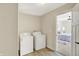 Convenient laundry room with washer, dryer, and access to bedroom at 3264 Orchard Ave, Indianapolis, IN 46218