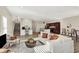 Open-concept living room with kitchen view, neutral color palette at 3264 Orchard Ave, Indianapolis, IN 46218