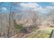 Backyard and wooded area viewed from the back deck of this home at 3510 E Copperstone Rd, Martinsville, IN 46151