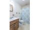 Bathroom features a vanity, toilet, and shower with blue patterned curtain at 3510 E Copperstone Rd, Martinsville, IN 46151