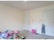 Neutral bedroom has ceiling fan, 2 doors and wall to wall carpet at 3510 E Copperstone Rd, Martinsville, IN 46151