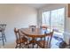 A dining area featuring an oval wood table and chairs, next to the sliding glass door to the patio at 3510 E Copperstone Rd, Martinsville, IN 46151