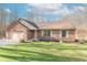 Charming brick home with an attached two-car garage and manicured lawn at 3510 E Copperstone Rd, Martinsville, IN 46151