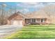 Attractive brick home with a two-car garage and a well-maintained lawn at 3510 E Copperstone Rd, Martinsville, IN 46151