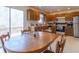 A kitchen featuring wood cabinets, laminate flooring, and a sliding door for outside access at 3510 E Copperstone Rd, Martinsville, IN 46151