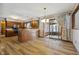 Open dining area with hardwood floors and access to a sunroom at 4289 S Carrie Dr, New Palestine, IN 46163