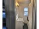 Clean bathroom with white vanity and dark floor at 431 N 18Th Ave, Beech Grove, IN 46107