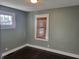 Cozy bedroom with dark hardwood floors and neutral walls at 431 N 18Th Ave, Beech Grove, IN 46107